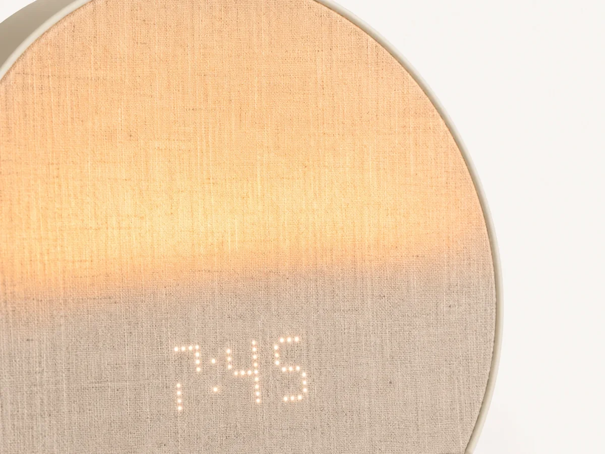 Hatch Restore 3 glowing during a sunrise routine in a bedroom